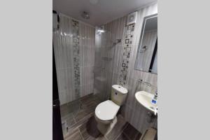 Koupelna v ubytování Hermoso y cómodo apartamento
