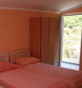 Postel nebo postele na pokoji v ubytování Apartmans Hari