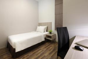 Letto o letti in una camera di Citadines Uplands Kuching