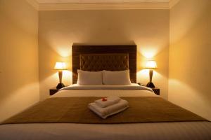 Postel nebo postele na pokoji v ubytování Hotel One Lalazar Multan