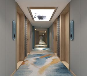 a hallway with a carpet with a ceiling at Happy Dragon Universal Vacation Hotel - close to Universal Studio and Wanda Plaza,free shuttle to the Resort,Free Coffee,Laundry in Beijing