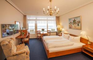 Postel nebo postele na pokoji v ubytování Strandhotel Monbijou GmbH garni