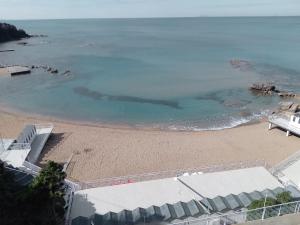 an aerial view of a beach with the ocean at Caletta Beach in Castiglioncello
