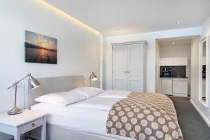 Postel nebo postele na pokoji v ubytování Luxx City Apartments