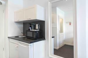 Kuchyň nebo kuchyňský kout v ubytování Luxx City Apartments
