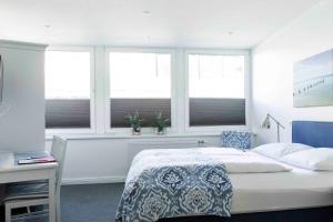 Postel nebo postele na pokoji v ubytování Luxx City Apartments