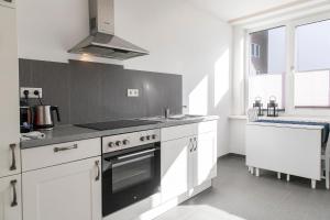 Kuchyň nebo kuchyňský kout v ubytování Luxx City Apartments