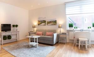 TV a/nebo společenská místnost v ubytování Luxx City Apartments