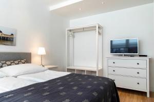 Postel nebo postele na pokoji v ubytování Luxx City Apartments