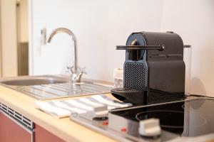 Kuchyň nebo kuchyňský kout v ubytování Luxx City Apartments