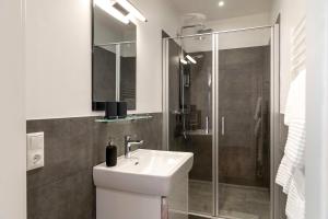 Koupelna v ubytování Luxx City Apartments
