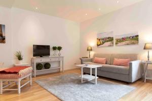 TV a/nebo společenská místnost v ubytování Luxx City Apartments