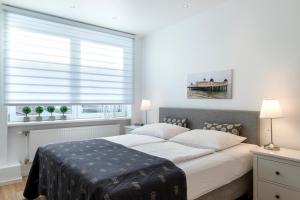 Postel nebo postele na pokoji v ubytování Luxx City Apartments