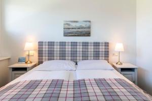 Ένα ή περισσότερα κρεβάτια σε δωμάτιο στο Luxx City Apartments