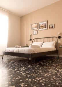 Letto o letti in una camera di Four Rooms Alghero