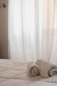 Letto o letti in una camera di Four Rooms Alghero