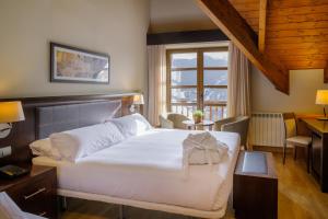Ένα ή περισσότερα κρεβάτια σε δωμάτιο στο Snö Aragon Hills