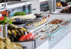 a buffet line with many different types of food at Primasol Hane Family Resort Hotel in Side