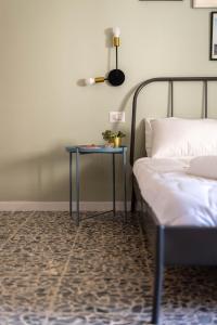 Letto o letti in una camera di Four Rooms Alghero