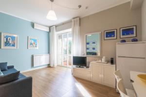 Телевизор и/или развлекательный центр в Residence Sole Mare Alaxi Hotels