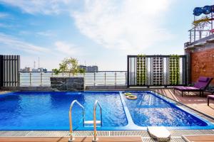 a swimming pool on the roof of a building at Grand Palace Hotel & Resort Sylhet in Sylhet