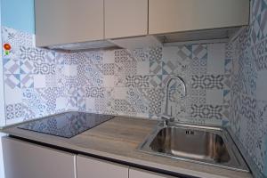 Кухня или мини-кухня в Residence Sole Mare Alaxi Hotels
