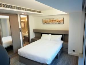Voodi või voodid majutusasutuse Mia Casa Hotel toas