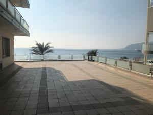 a balcony with a view of the ocean at Hotel Miramare in Savona