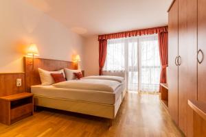 Postel nebo postele na pokoji v ubytování Club Hotel am Kreischberg