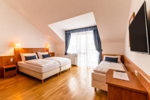 Postel nebo postele na pokoji v ubytování Club Hotel am Kreischberg