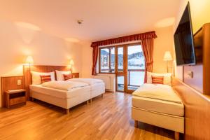 Postel nebo postele na pokoji v ubytování Club Hotel am Kreischberg