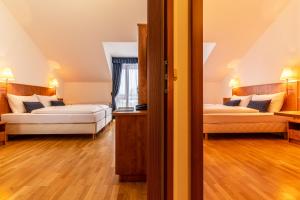 Postel nebo postele na pokoji v ubytování Club Hotel am Kreischberg