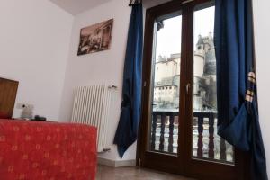 Postel nebo postele na pokoji v ubytování Hotel Residence Chateau