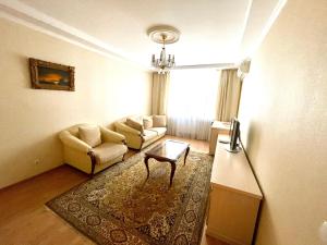 a living room with a couch and a table at Apartment Mala Zhytomyrska 10 in Kyiv