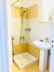 a bathroom with a shower and a sink at Room in Studio - Amazing 1 bed room apartment Banos and Swimming Pool in Roda