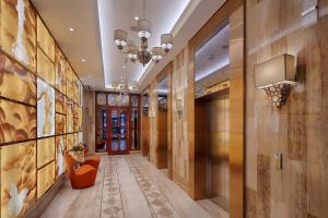 a hallway of a hotel with a hallway at Sherwood Suites in Ho Chi Minh City