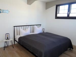 Postel nebo postele na pokoji v ubytování Speicher Residenz Barth E2 App 1