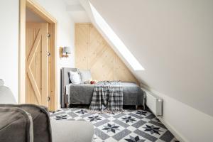 Łóżko lub łóżka w pokoju w obiekcie Apartamenty Pod Stokiem Nosal Zakopane