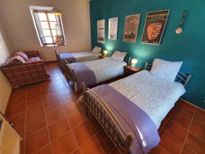 Ein Bett oder Betten in einem Zimmer der Unterkunft Albergue Villares de Orbigo