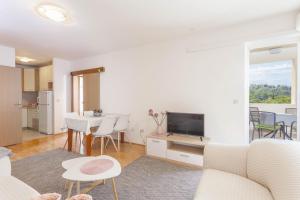 TV a/nebo společenská místnost v ubytování Apartment Merry Center & Beach