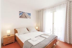 Postel nebo postele na pokoji v ubytování Apartment Merry Center & Beach
