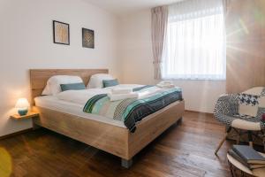 Posteľ alebo postele v izbe v ubytovaní Apartmány Resort Vrchlabí