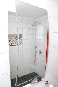 a shower with a glass door in a bathroom at Luxury Villa Siniori in Keramoti +63 photos