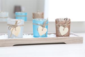 a tray with three glasses with hearts on it at Luxury Villa Siniori in Keramoti