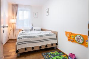 Posteľ alebo postele v izbe v ubytovaní Apartmány Resort Vrchlabí