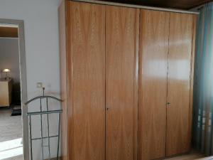 a large wooden cabinet in a room at Ferienwohnung Michael Vogl in Bodenmais