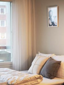Postel nebo postele na pokoji v ubytování 2ndhomes Tampere "Rautatieasema" Apartment - Heartful New Apt with Balcony in the City Center