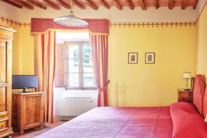 Postel nebo postele na pokoji v ubytování Hotel Borgo Casabianca