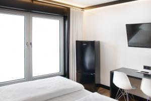 TV a/nebo společenská místnost v ubytování BI Hotel by WMM Hotels