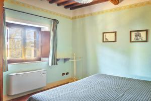 Postel nebo postele na pokoji v ubytování Hotel Borgo Casabianca